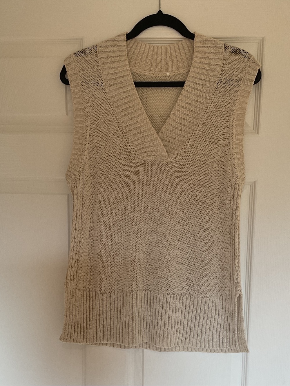 Sweater vest, size medium.